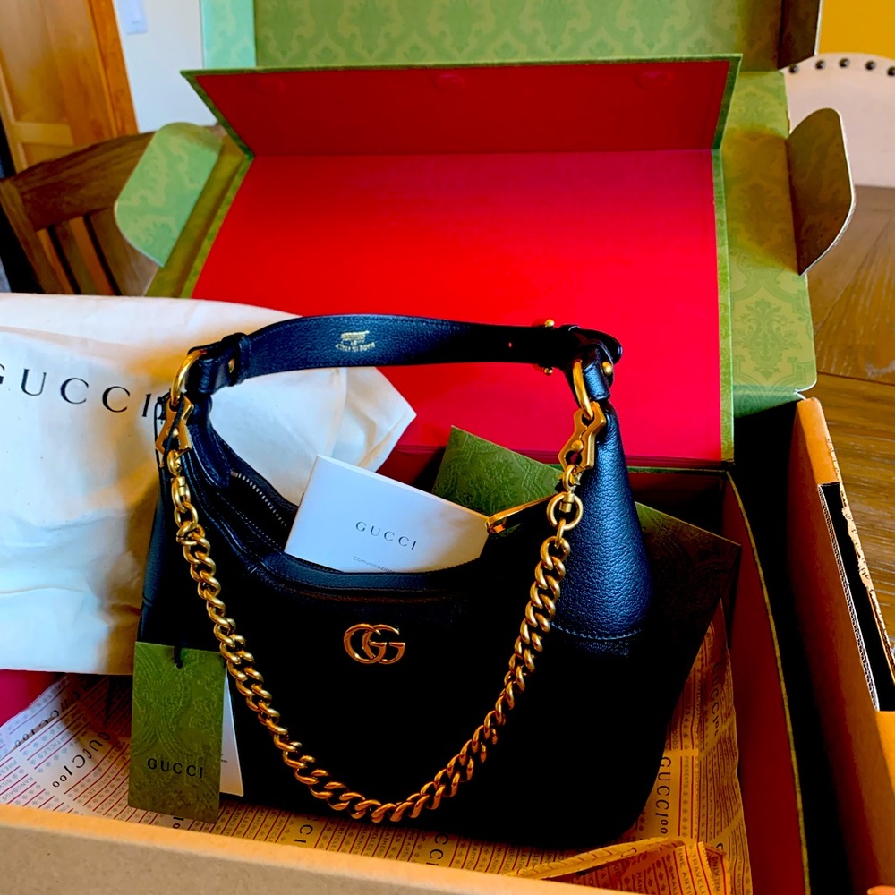 Brand new Gucci, crescent shaped, black shoulder bag